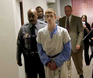Derek Shrout, 17, alleged hate crime bomb plotter, escorted from Russell County Court on Monday (Ledger-Enquirer image).