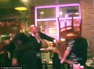 After peppering a gay couple with homophobic slurs, an assailant beats the men with a wooden chair. 
