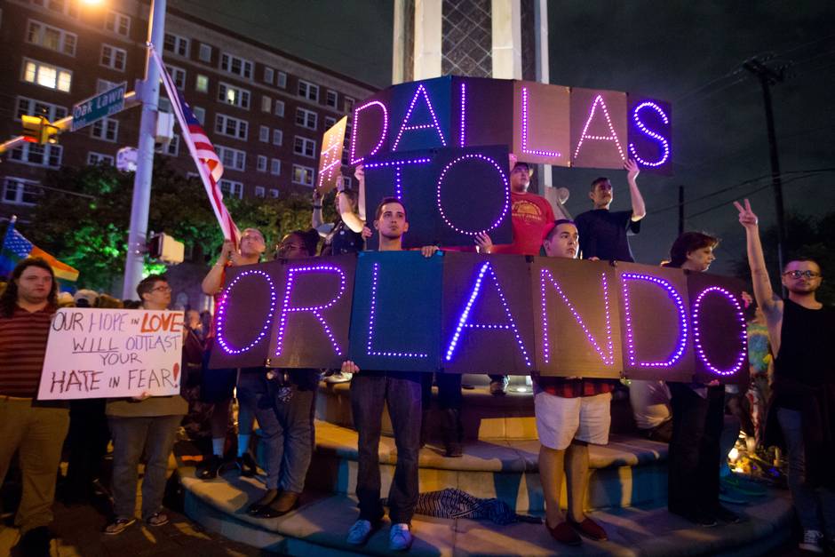 Hundreds of LGBT Dallasites and allies rally in solidarity with Orlando despite the rain.